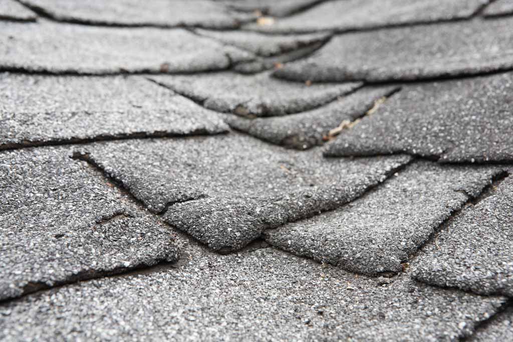 Aged and cracked asphalt shingles