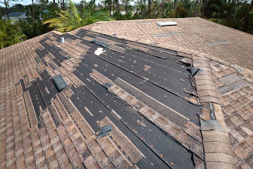 A roof with storm damage 