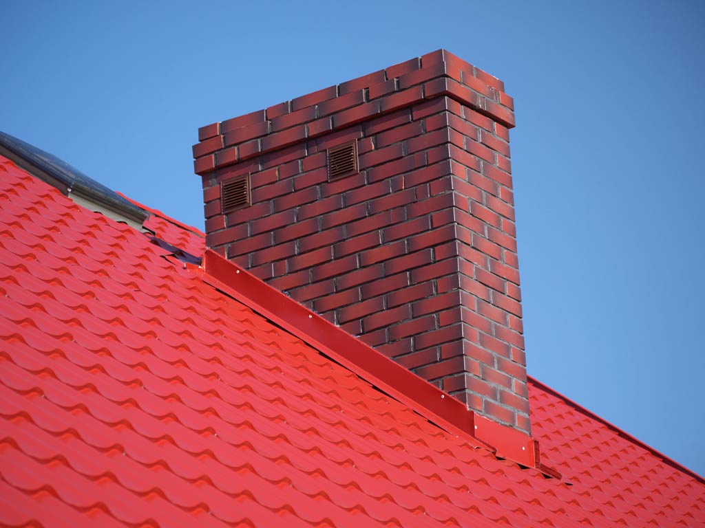 Red metal flashing around a chimney