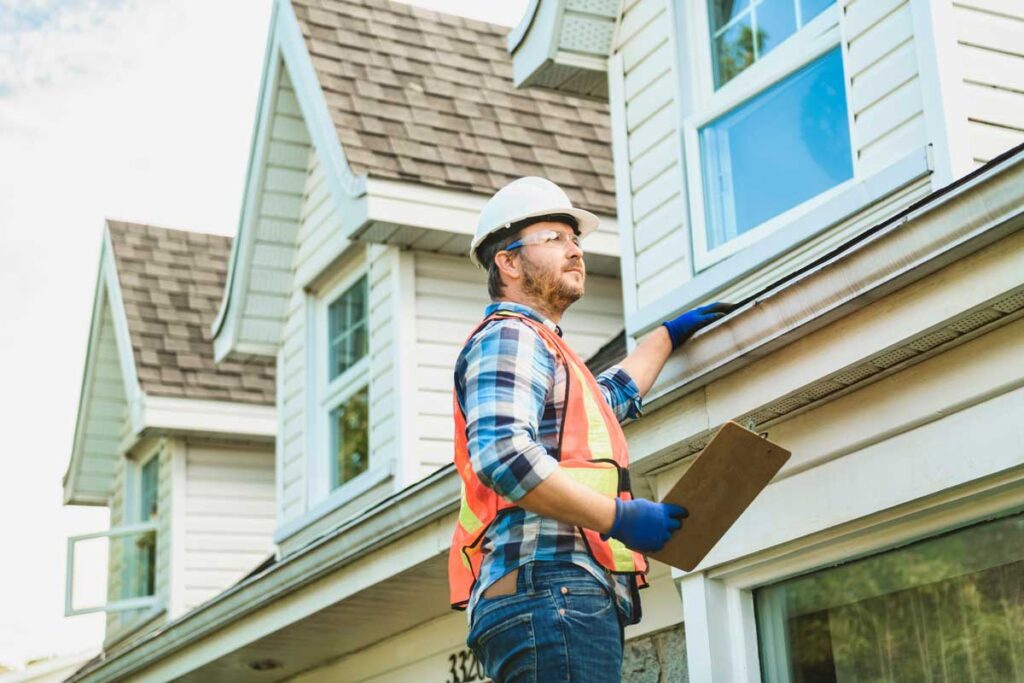 A roof inspector with a clipboard 